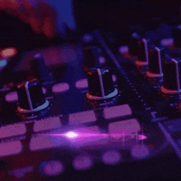 a picture of a woman in front of a mixer with a purple light behind her