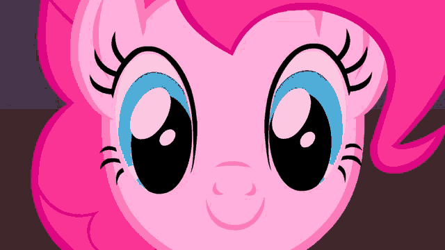 a close up of a pink pony with blue eyes