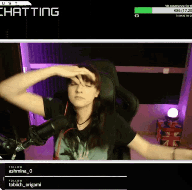 a woman sitting in front of a microphone with the word chatting on the top left