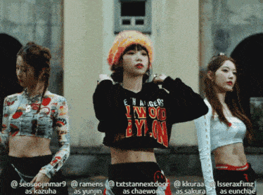 a girl wearing a crop top that says ' lwo by on ' on it