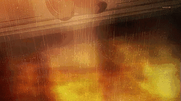 a close up of a microwave with a flame coming out of it