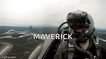 a man in a helmet is flying a fighter jet with the word maverick written above him .