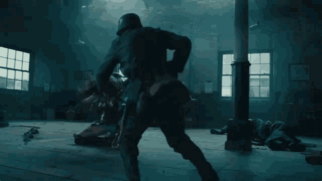 a woman in a wonder woman costume is fighting a man