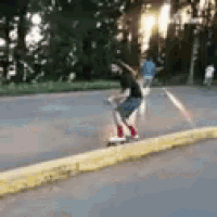 a person is riding a skateboard down a sidewalk .