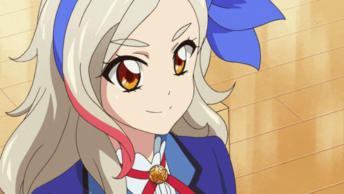 a girl with blonde hair and red highlights is wearing a blue jacket
