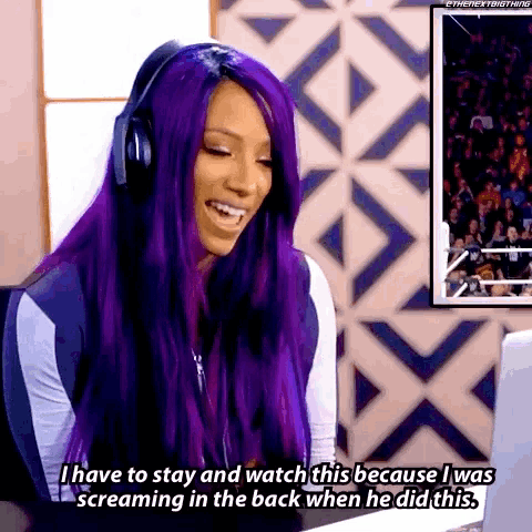 a woman with purple hair is wearing headphones and says i have to stay and watch this