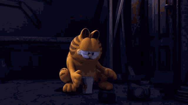 a cartoon character named garfield is sitting on the ground with smoke coming out of his eyes