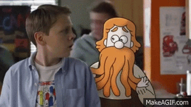 a boy is standing next to a cartoon of a man with a beard and tentacles .