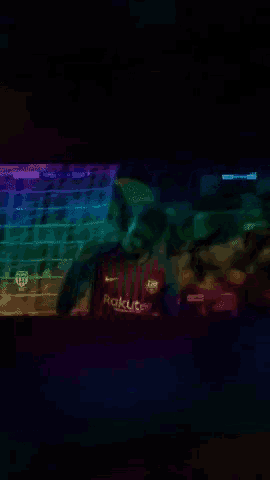 a blurred image of a man wearing a shirt that says rakuten