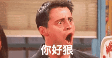 a man in a suit is making a funny face with his mouth open in chinese .