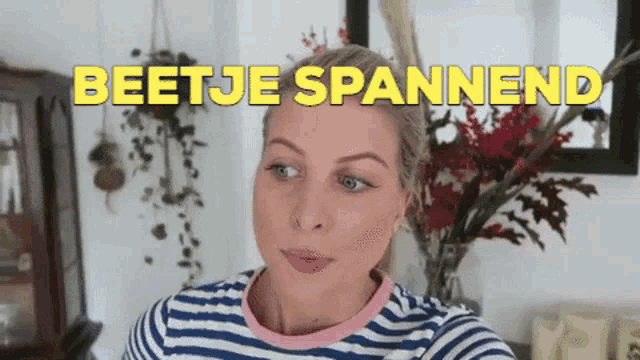 a woman in a striped shirt with the words beetje spannend on the top