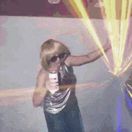 a woman in a wig and sunglasses is holding a can of beer