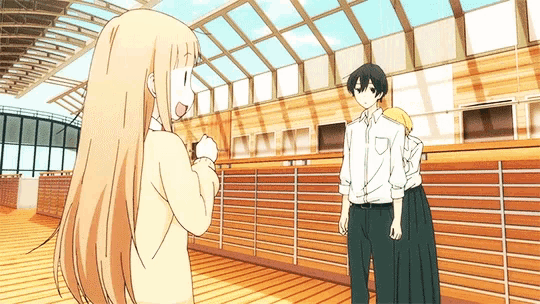 a boy and a girl are standing next to each other