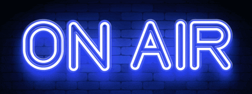 a neon sign that says on air on a dark blue background