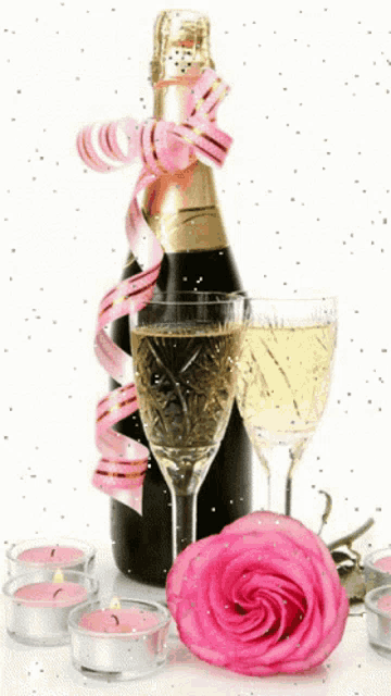 a bottle of champagne with a pink ribbon and two glasses next to a pink rose and candles