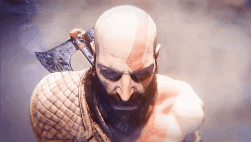 a man with a beard is holding a large axe