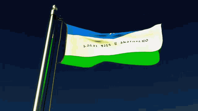 a blue white and green flag that says ' on ' on the bottom