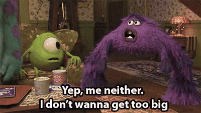 mike and sully from monsters inc are sitting on a couch talking to each other