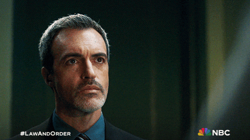 a man in a suit and tie is featured on a nbc ad
