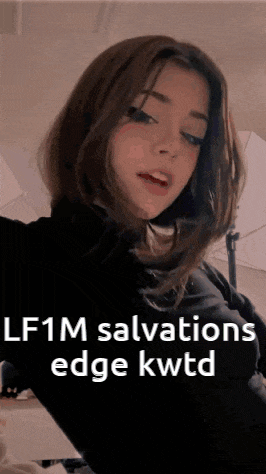 a girl taking a selfie with the words lf1m salvations edge kwtd