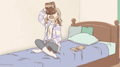 a girl is sitting on a bed holding a bag of cookies