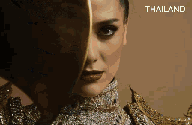 a close up of a woman 's face with the word thailand in the corner