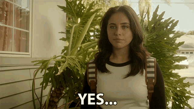 a young woman with a backpack says yes