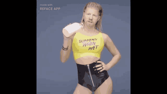 a woman in a yellow top that says " sloppy when wet "