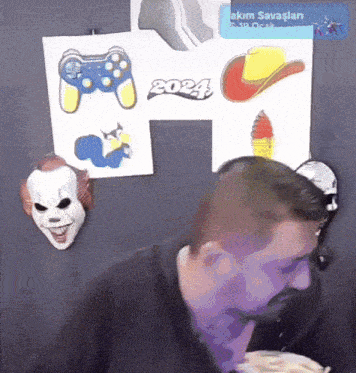 a man eating a meal in front of a sign that says 2024 on it