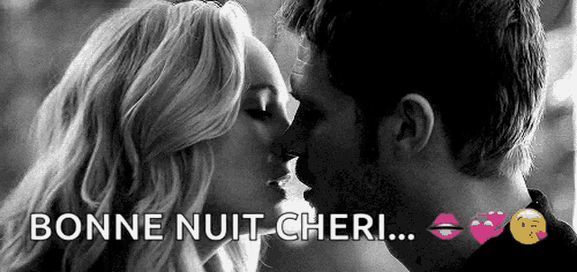 a black and white photo of a man and woman kissing with the words `` bonne nuit cheri '' above them .