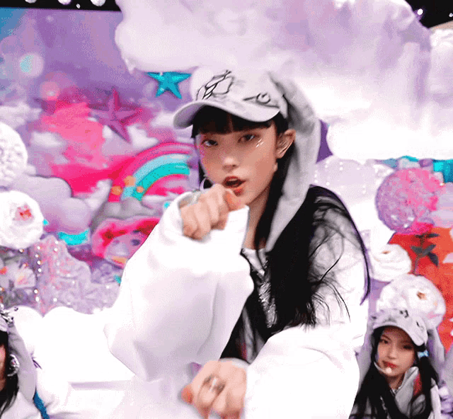 a girl wearing a hat that says ' x ' on it