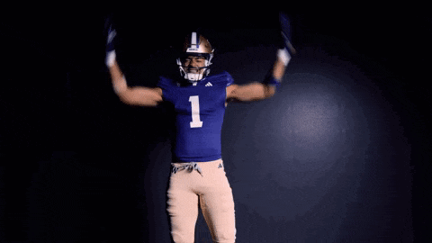 a football player in a blue uniform with the number 1 on it