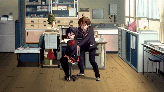 a couple of anime characters standing next to each other in an office