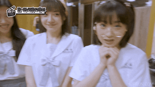 three girls are standing next to each other with gifrun.com written on the bottom
