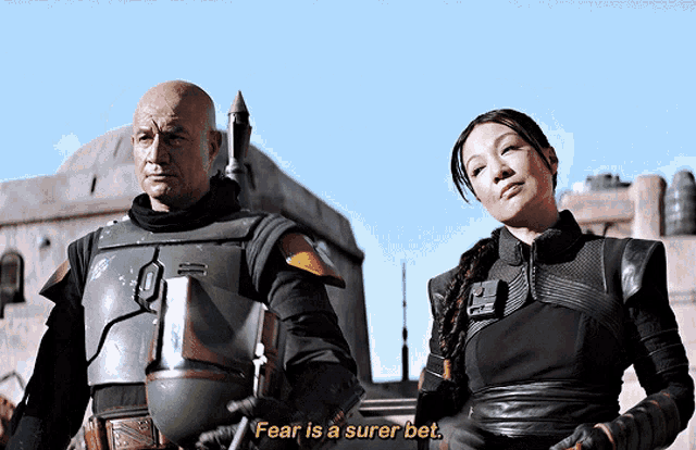 a man and a woman are standing next to each other and the man says fear is a sure bet