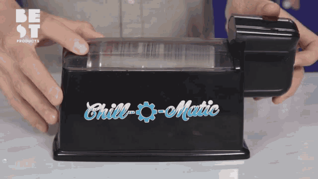 a person is holding a chill-o-matic machine