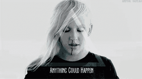 a black and white photo of a woman with a triangle in the background and the words `` anything could happen '' .
