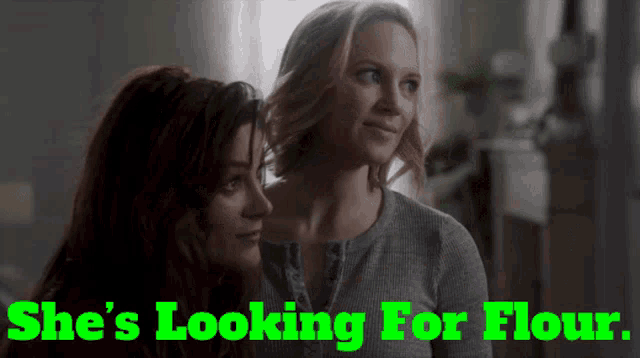two women are looking at each other with the words she 's looking for flour below them