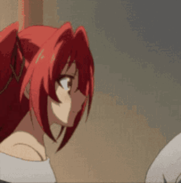 a girl with red hair has a ponytail on her head