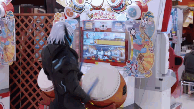 a person is playing a video game with a namco logo on it