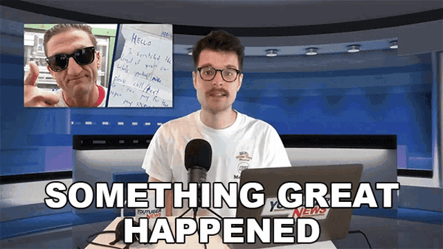 a man sitting in front of a laptop with the words something great happened on the bottom