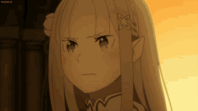 a close up of a girl with a flower in her hair and the words soanime.tv below her