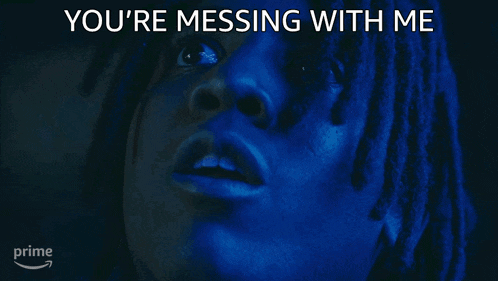 a close up of a person 's face with the words `` you 're messing with me '' above it