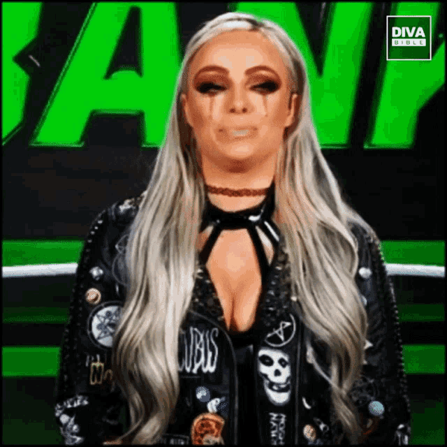 a woman in a black jacket with the word diva on the bottom