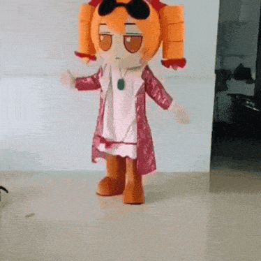 a stuffed doll wearing sunglasses and a dress