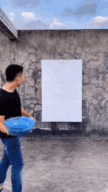 a man is throwing a frisbee in front of a white board .