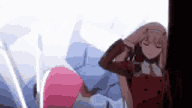 a couple of anime characters are standing next to each other . one of the characters is wearing a red jacket .