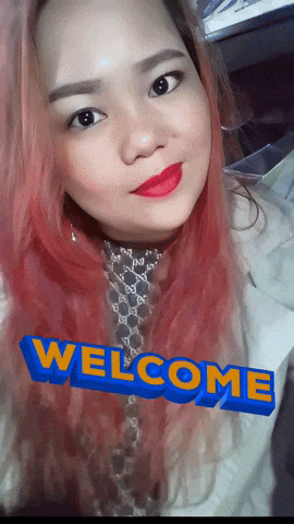 a woman with pink hair has the word welcome in blue