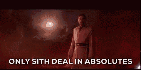 a man in a robe is standing in a dark room with the words `` only sith deal in absolutes '' written on the screen .