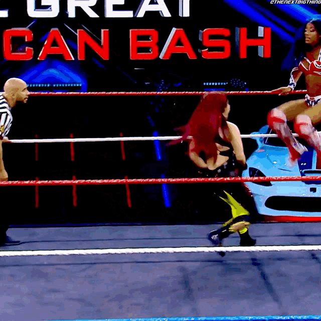 a woman in a wrestling ring with a sign that says great can bash on it
